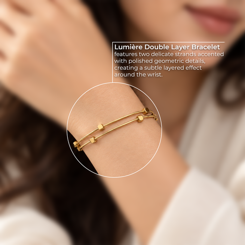 Close-up of the Lumière Double Layer Bracelet on a woman’s wrist, highlighting its delicate layered strands and geometric details.