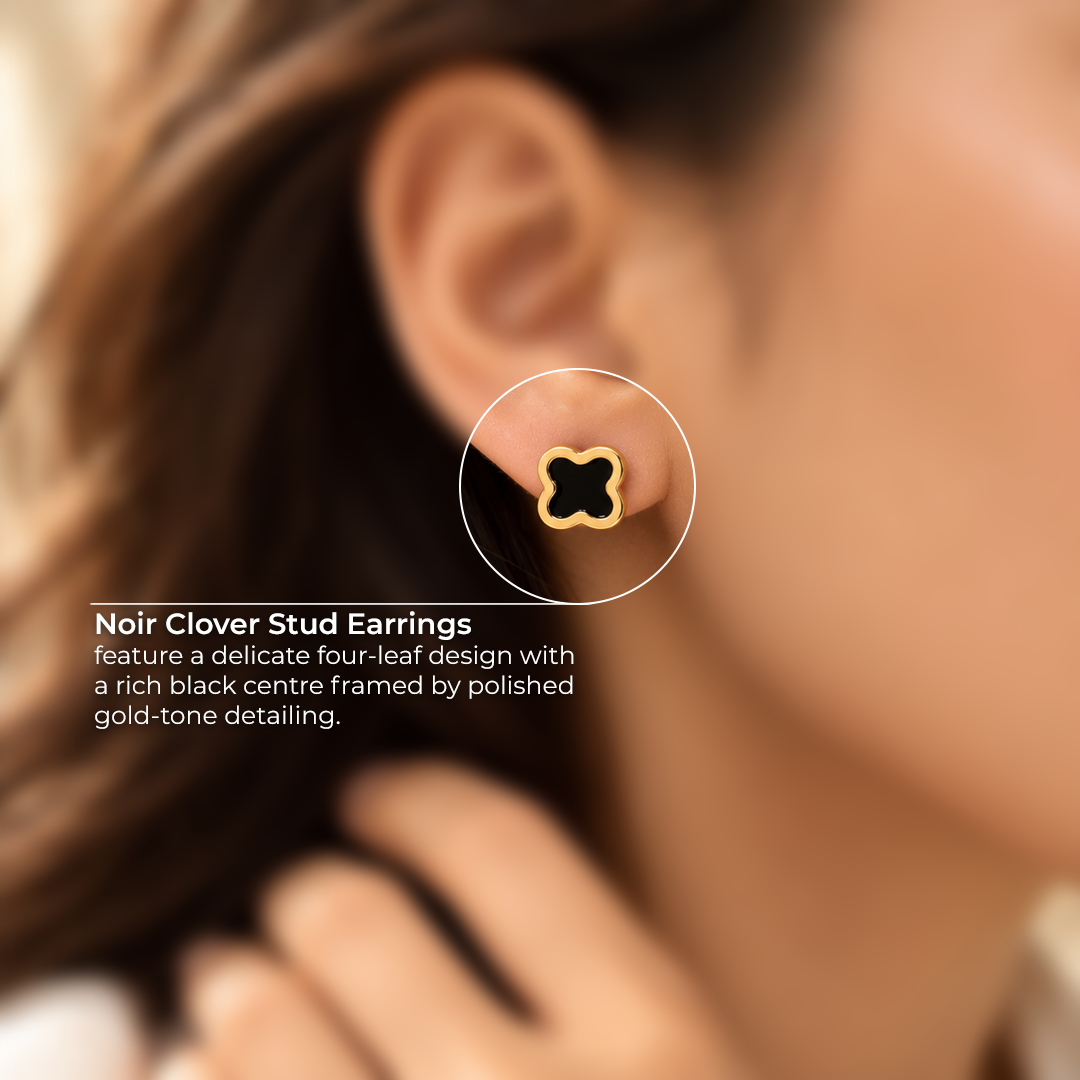 Close-up of a Noir Clover Stud Earring showing its four-leaf black centre and polished gold-tone frame.